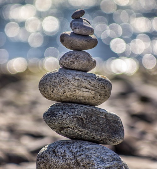 stack stones representing balance and taking a mental break to focus on marketing